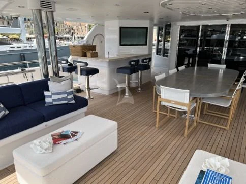 a living room with a couch and a table aboard SEANASH Yacht for Sale