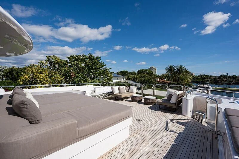 a deck with chairs and tables on it aboard SEANASH Yacht for Sale