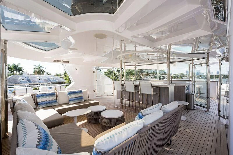 a room with a couch and a pool aboard SEANASH Yacht for Sale