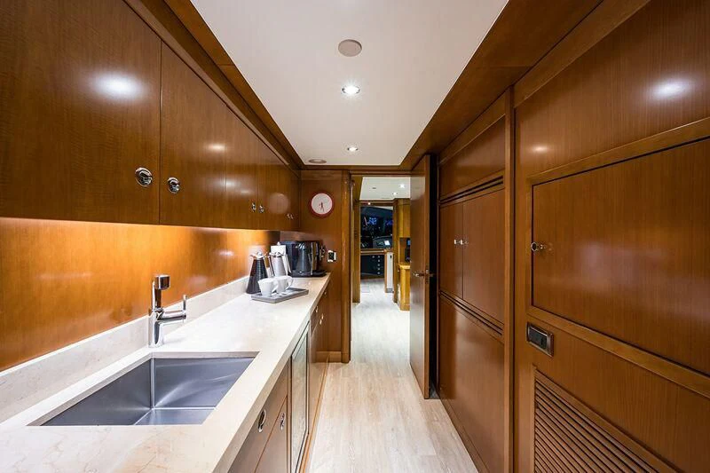 a kitchen with a sink and cabinets aboard SEANASH Yacht for Sale
