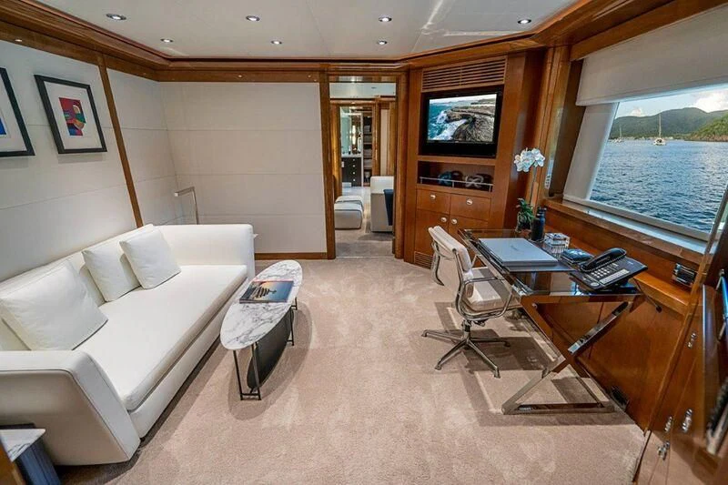 a living room with a large window aboard SEANASH Yacht for Sale