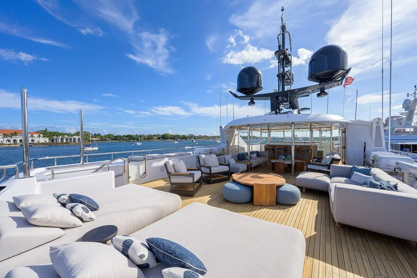 a deck with a large boat in the background aboard SEANASH Yacht for Sale