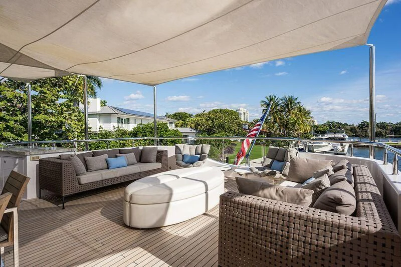 a patio with a couch and a large window aboard SEANASH Yacht for Sale