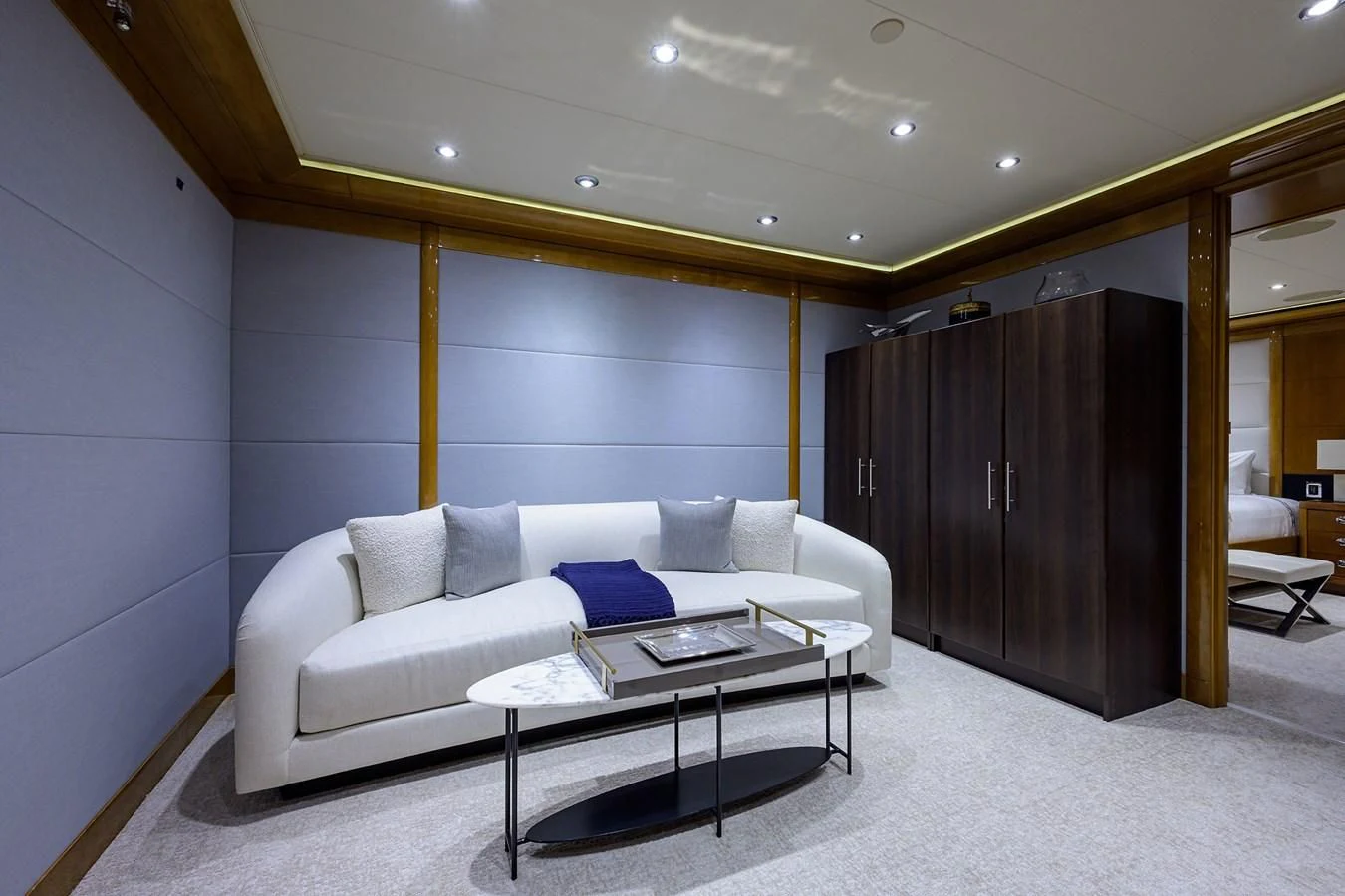 a living room with a couch and a table aboard SEANASH Yacht for Sale