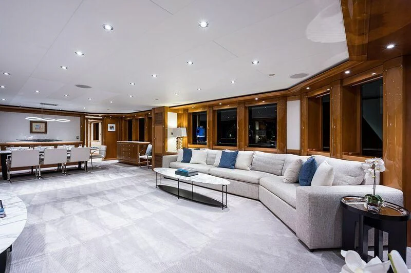 a large living room with a large white couch and a table aboard SEANASH Yacht for Sale