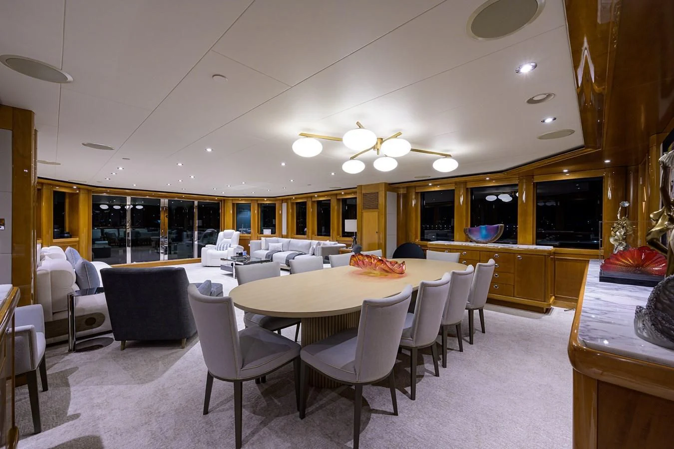a large room with tables and chairs aboard SEANASH Yacht for Sale