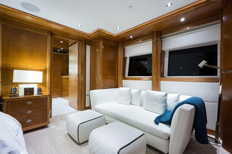 a living room with a white couch aboard SEANASH Yacht for Sale