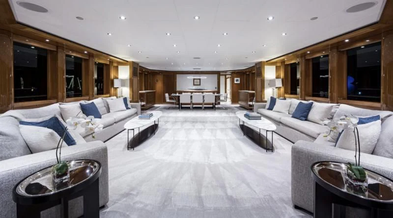 a large living room with white furniture aboard SEANASH Yacht for Sale