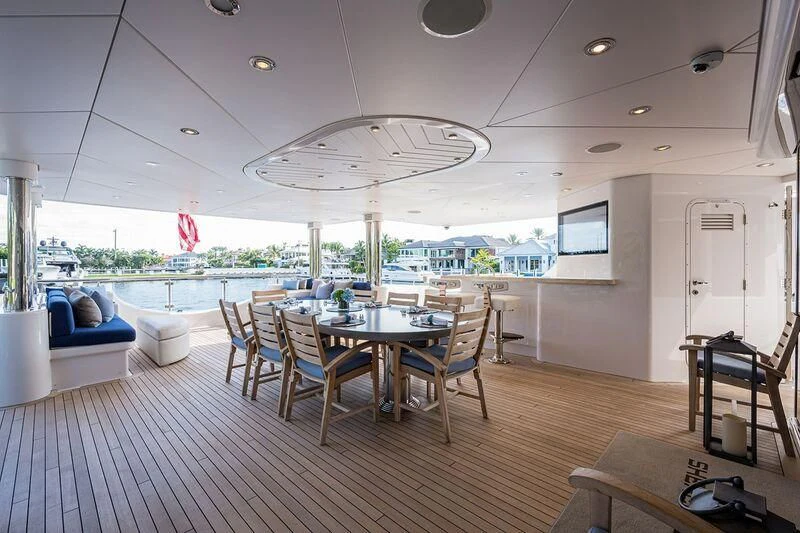 a room with a table and chairs aboard SEANASH Yacht for Sale