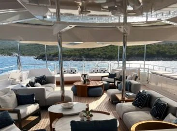 a room with a table and chairs aboard SEANASH Yacht for Sale
