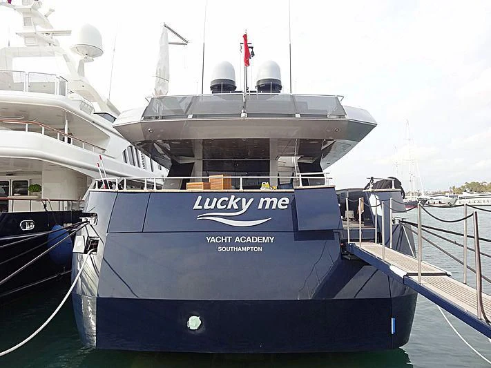 a large boat docked aboard LUCKY ME YACHT ACADEMY Yacht for Sale