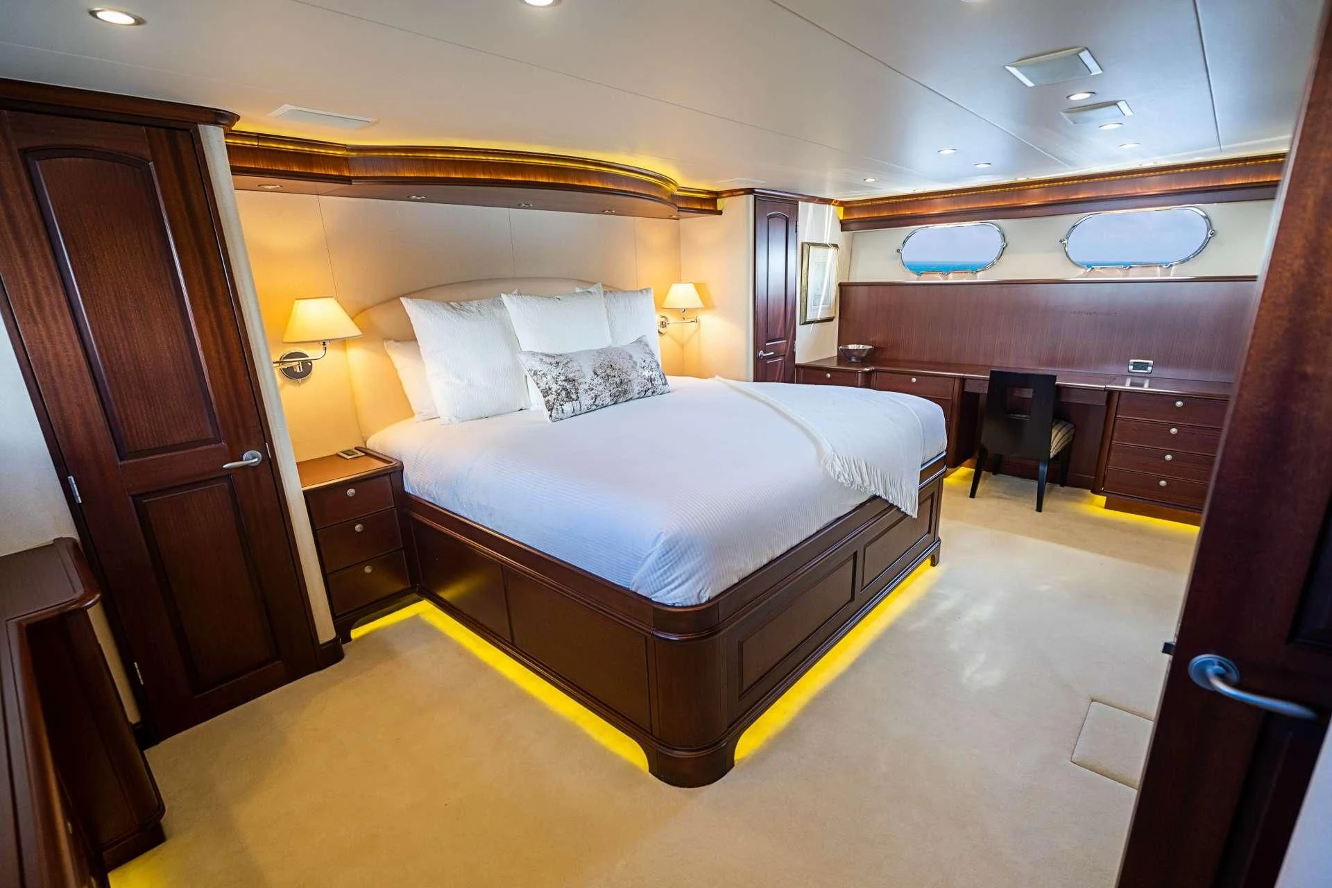 a large bed in a hotel room aboard BOOGIE BABE IV Yacht for Sale