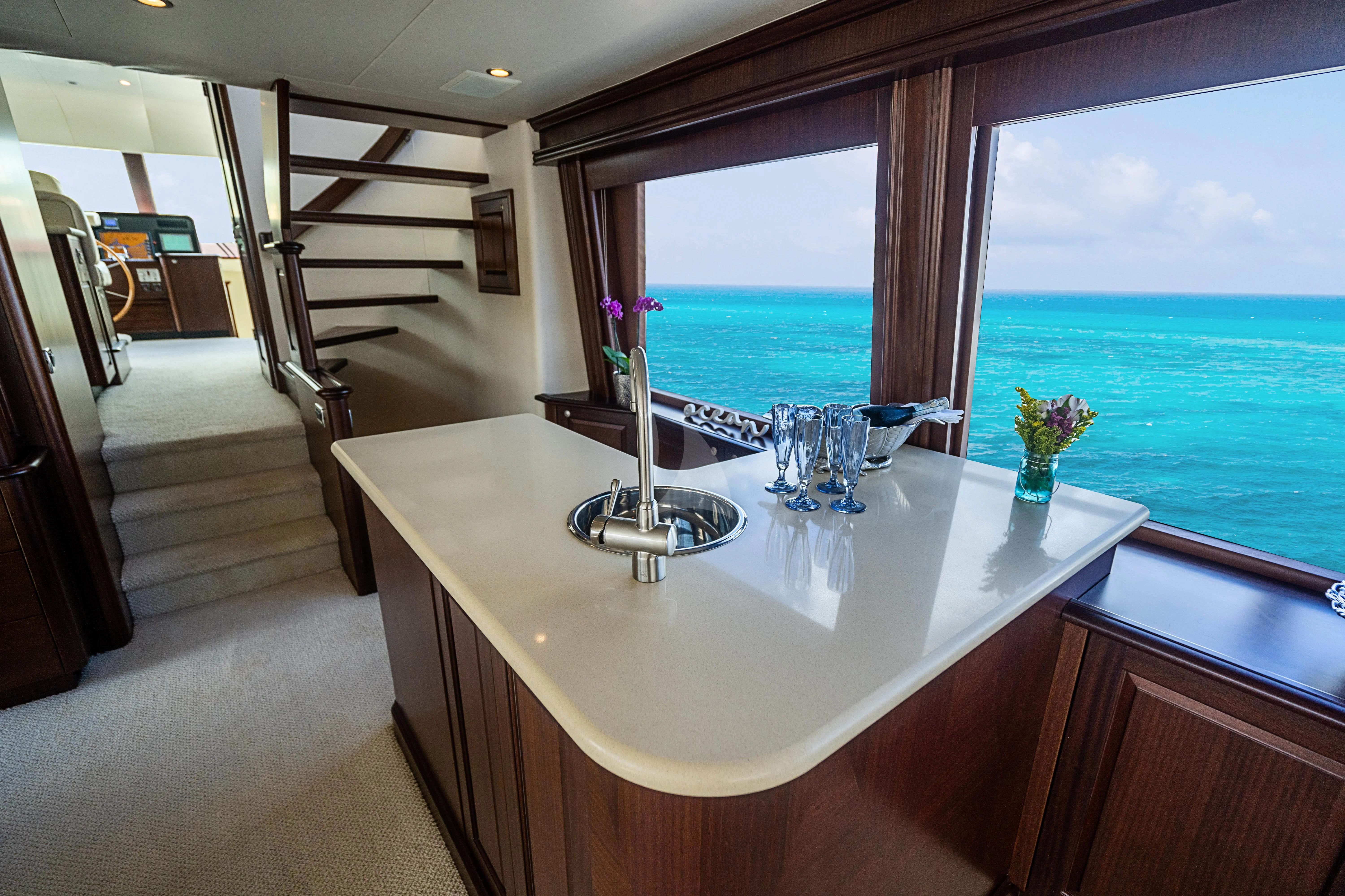 a bathroom with a large window overlooking the ocean aboard BOOGIE BABE IV Yacht for Sale