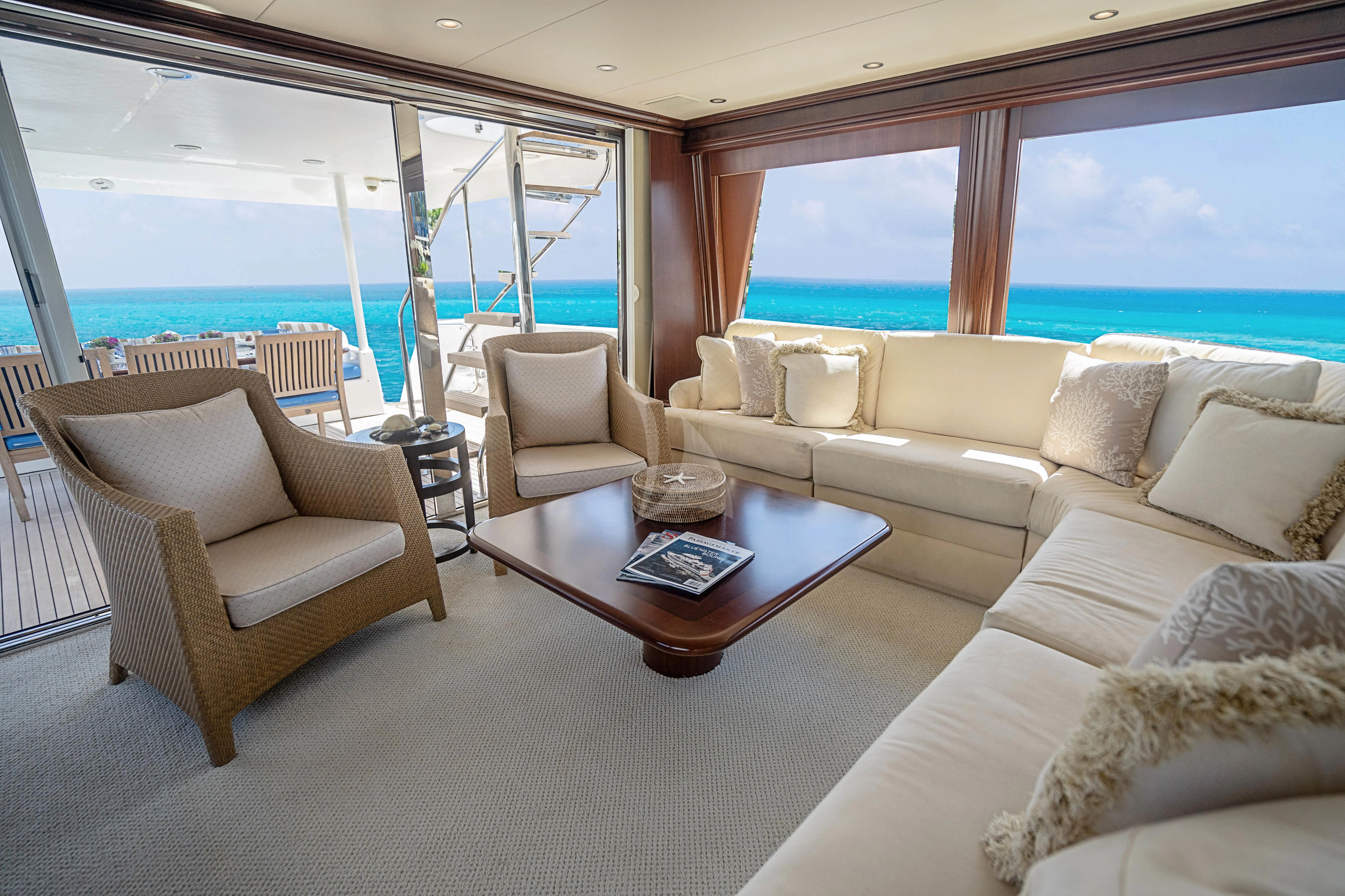 a living room with a large window aboard BOOGIE BABE IV Yacht for Sale