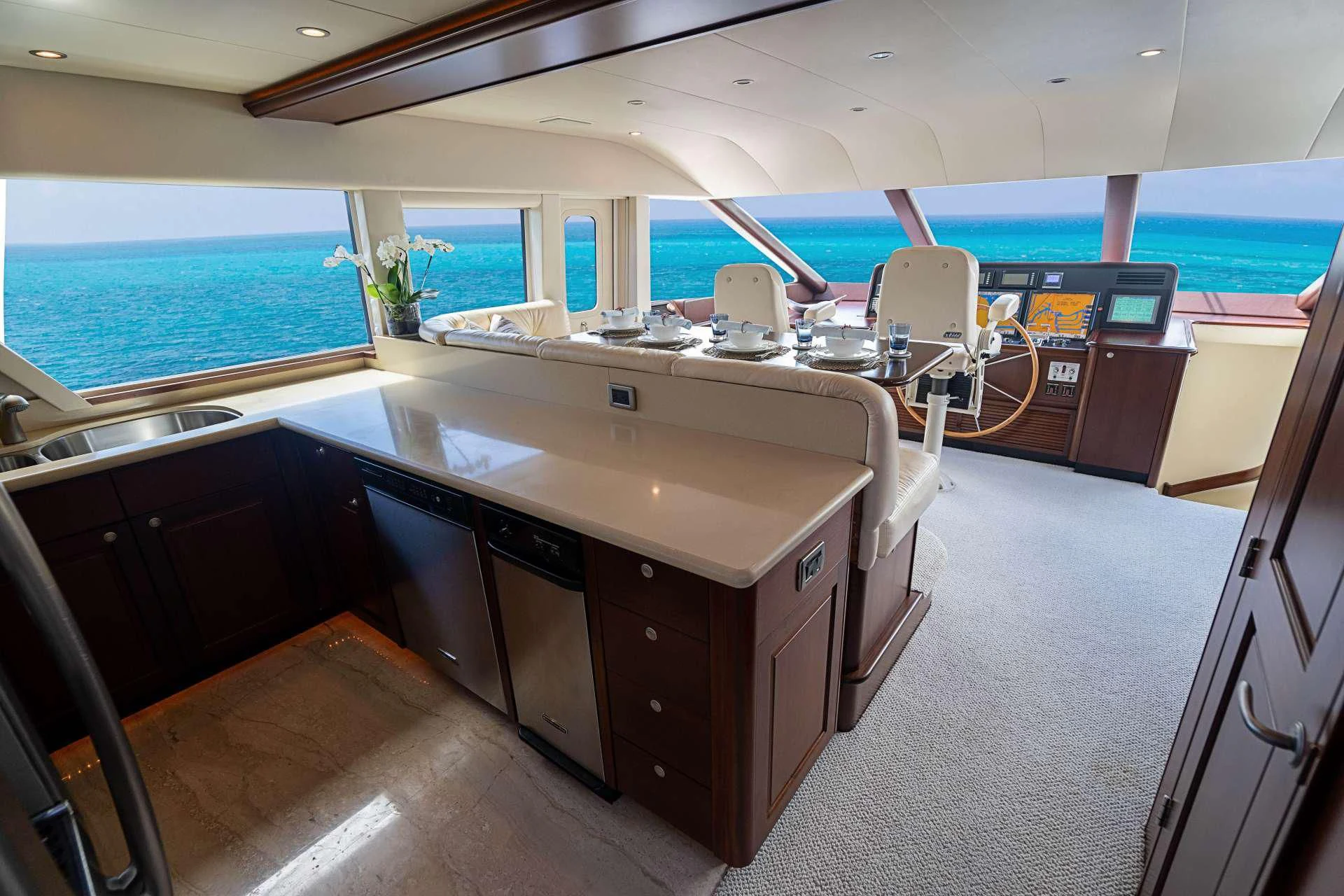 a large kitchen with a large island aboard BOOGIE BABE IV Yacht for Sale