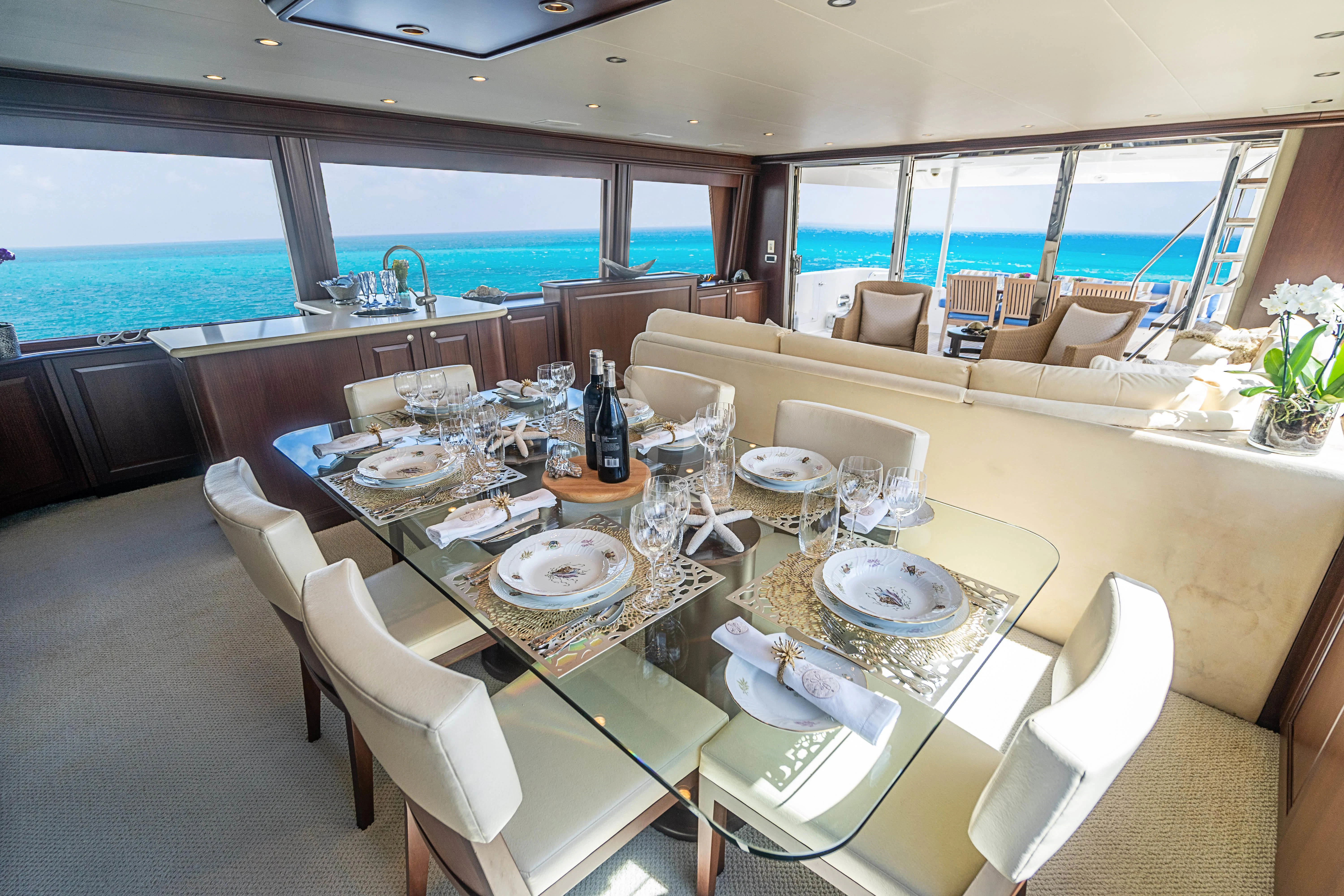 a dining room with a large table aboard BOOGIE BABE IV Yacht for Sale
