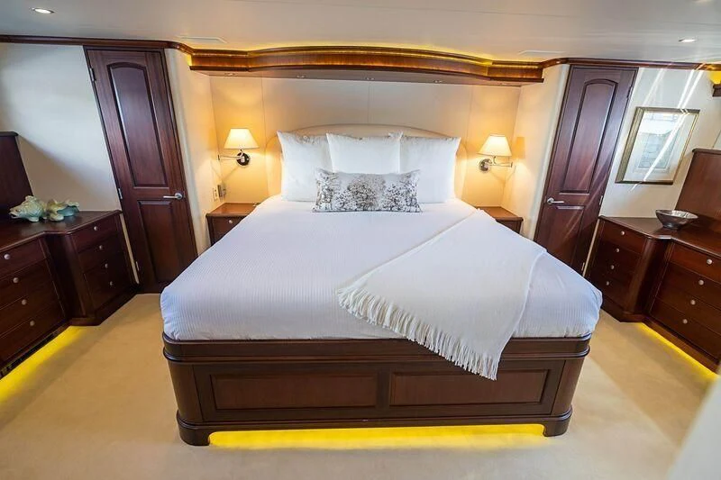 a bed in a hotel room aboard BOOGIE BABE IV Yacht for Sale
