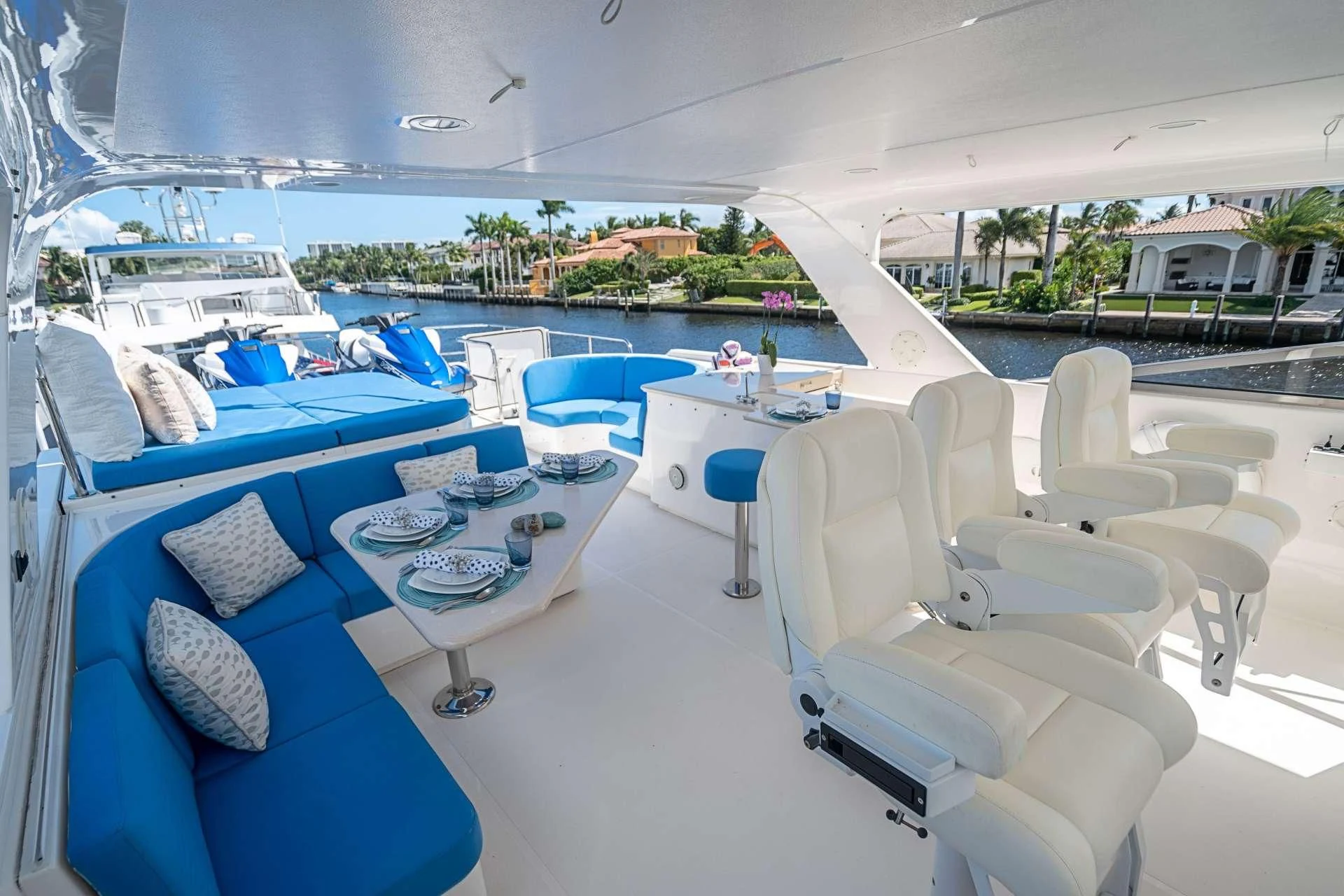 a room with a pool and lounge chairs aboard BOOGIE BABE IV Yacht for Sale
