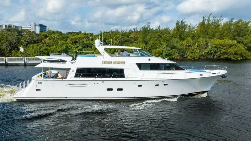 a white boat on water aboard BOOGIE BABE IV Yacht for Sale