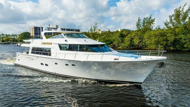 a white boat on the water aboard BOOGIE BABE IV Yacht for Sale