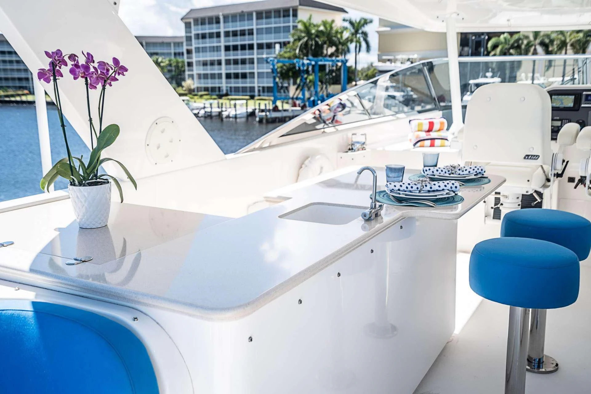 a white kitchen with a large window aboard BOOGIE BABE IV Yacht for Sale