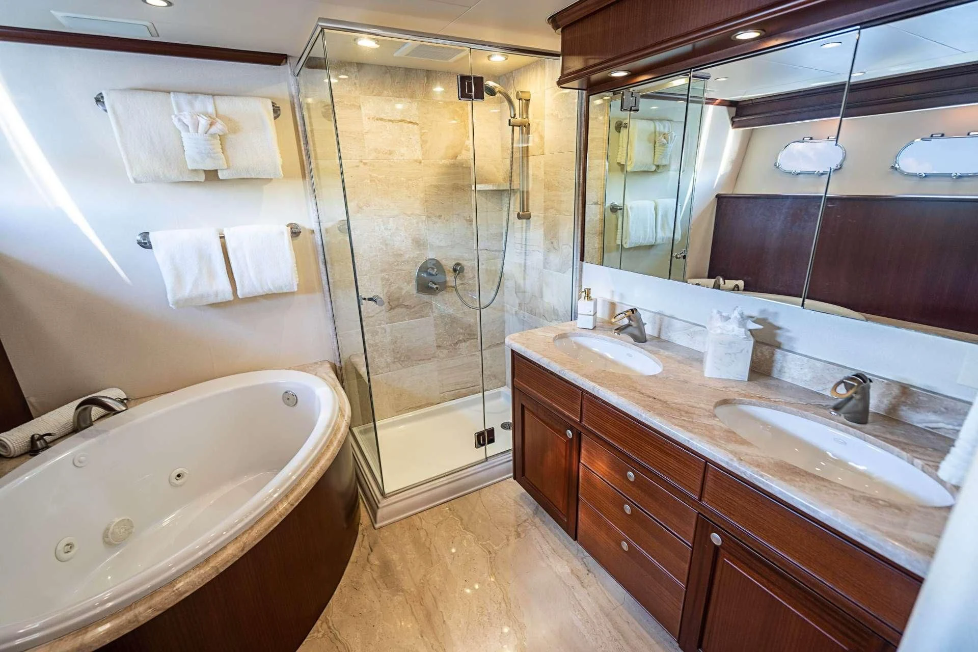 a bathroom with a large tub aboard BOOGIE BABE IV Yacht for Sale