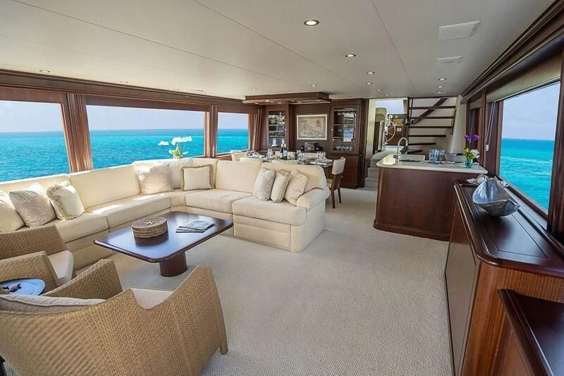 a living room with a large window aboard BOOGIE BABE IV Yacht for Sale