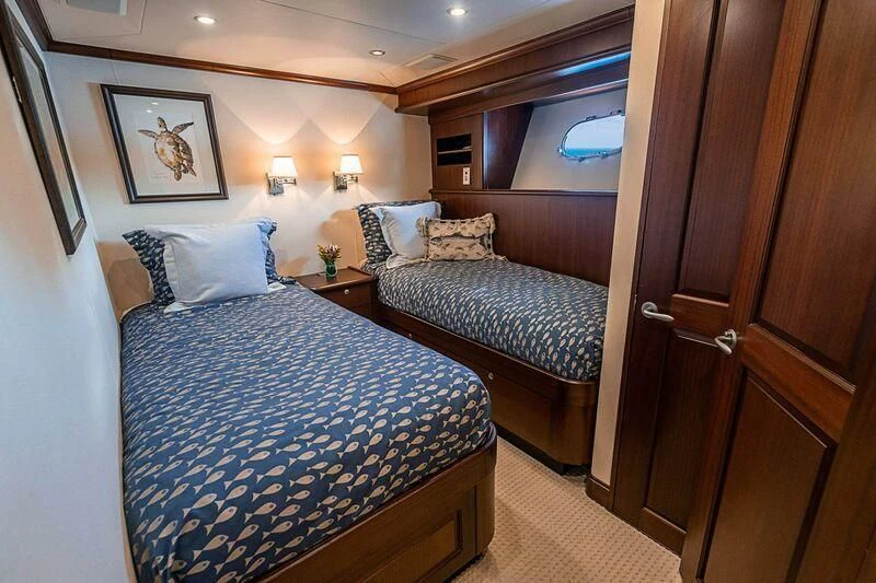 a couple of beds in a hotel room aboard BOOGIE BABE IV Yacht for Sale