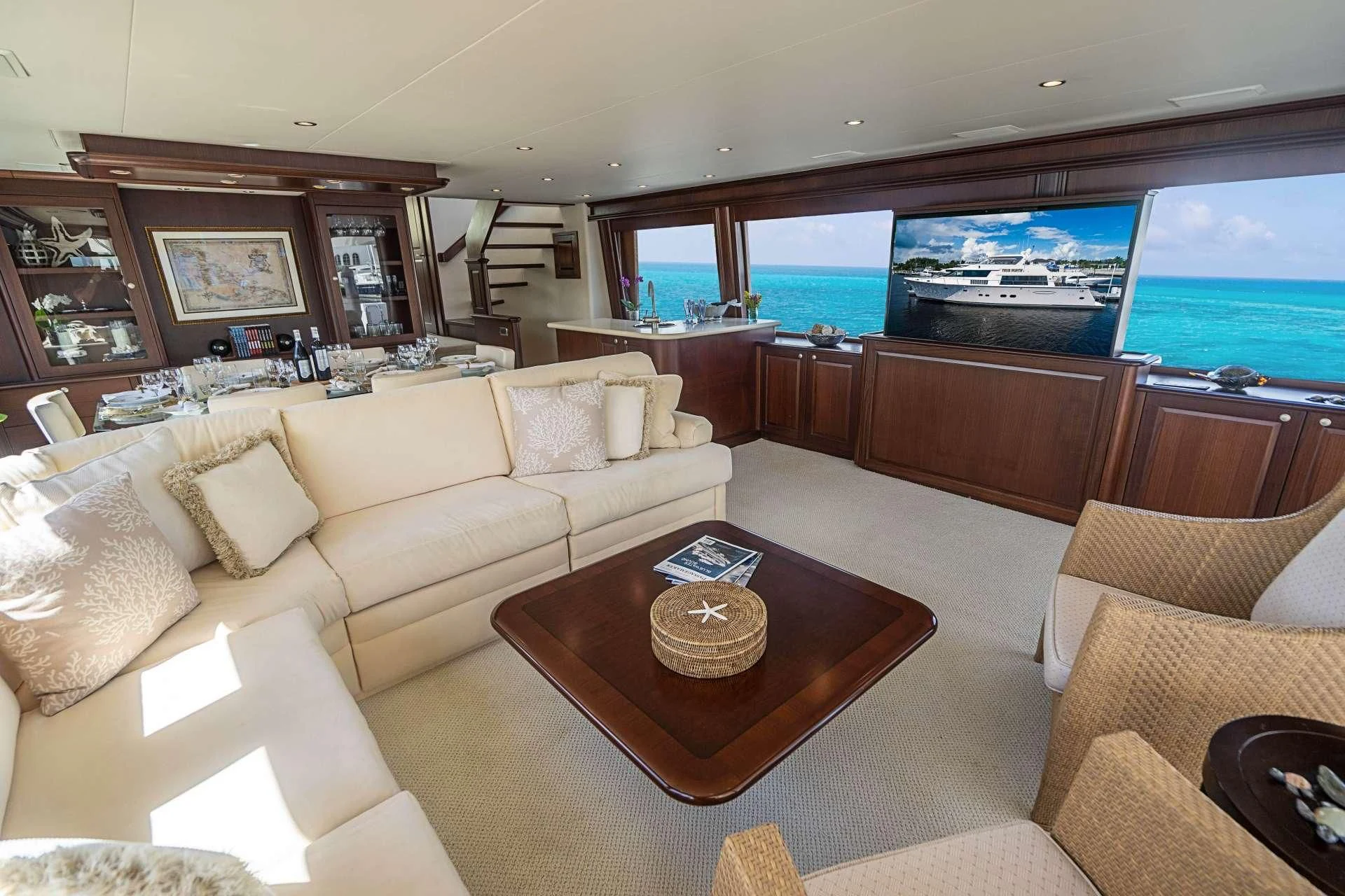 a living room with a large window aboard BOOGIE BABE IV Yacht for Sale