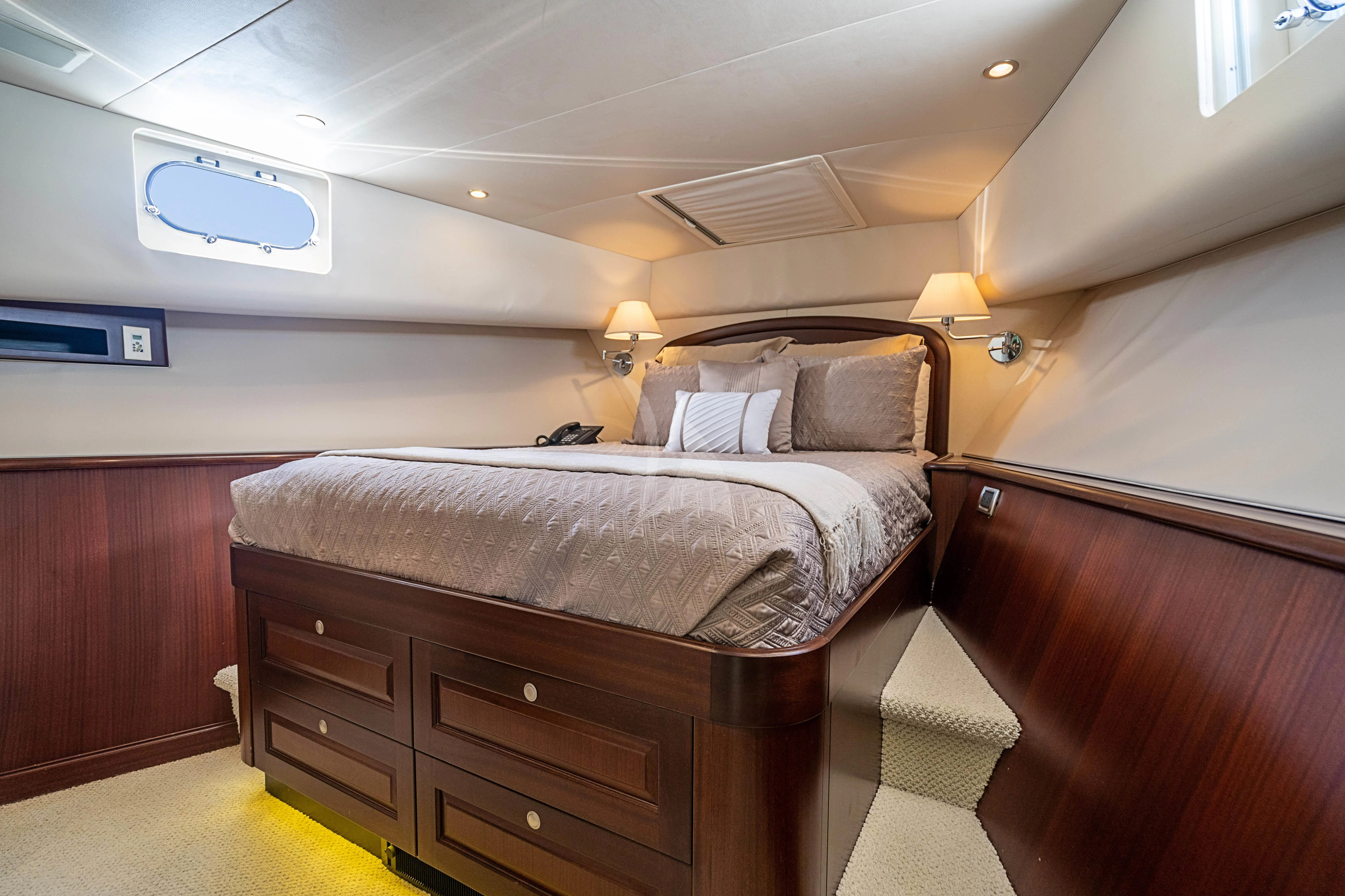 a bed in a room aboard BOOGIE BABE IV Yacht for Sale