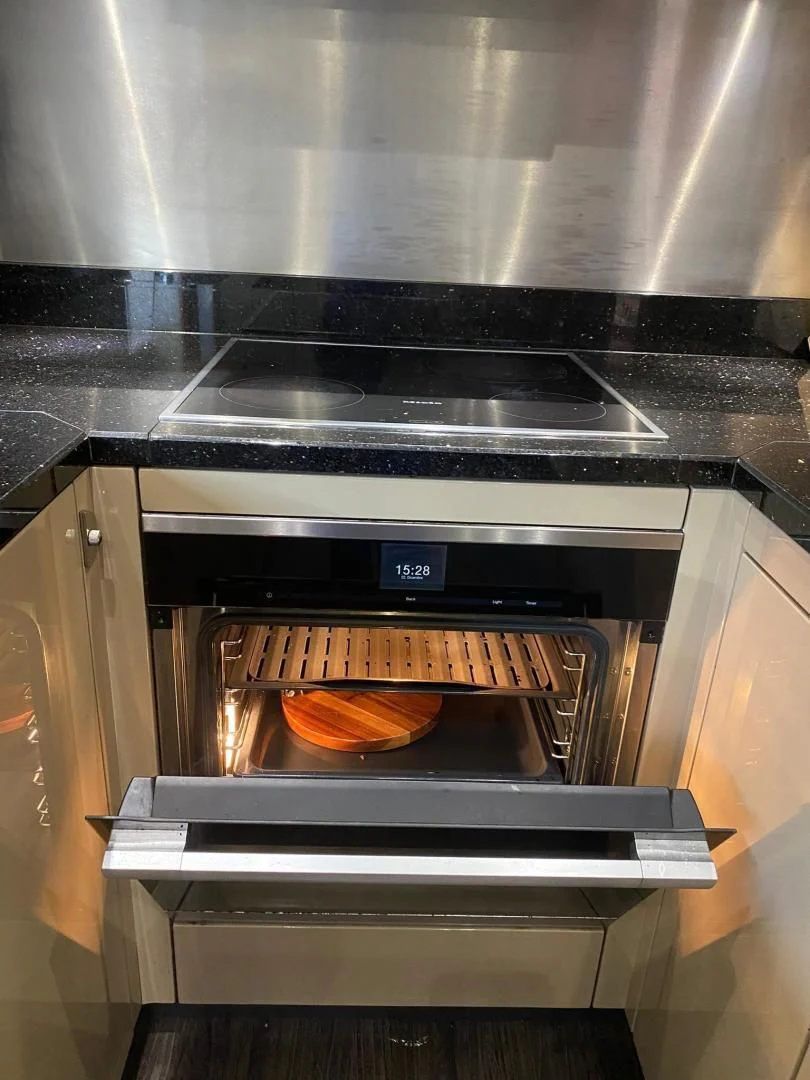 a hot dog is being cooked in an oven aboard RIII Yacht for Sale