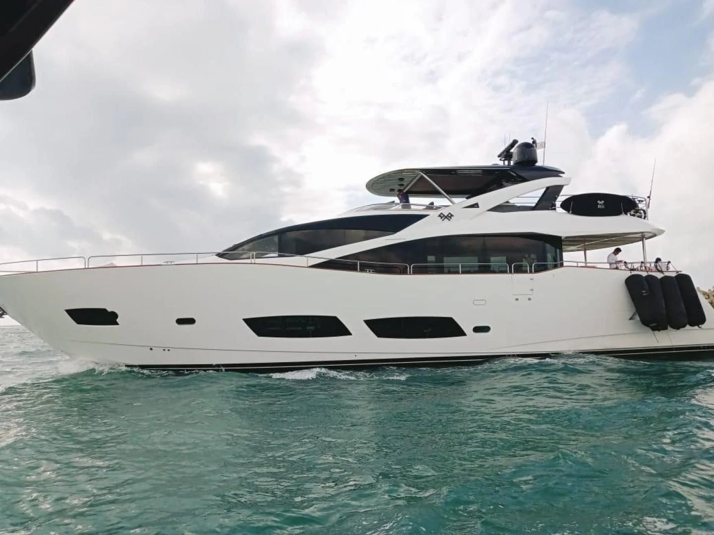 a white yacht in the water aboard RIII Yacht for Sale