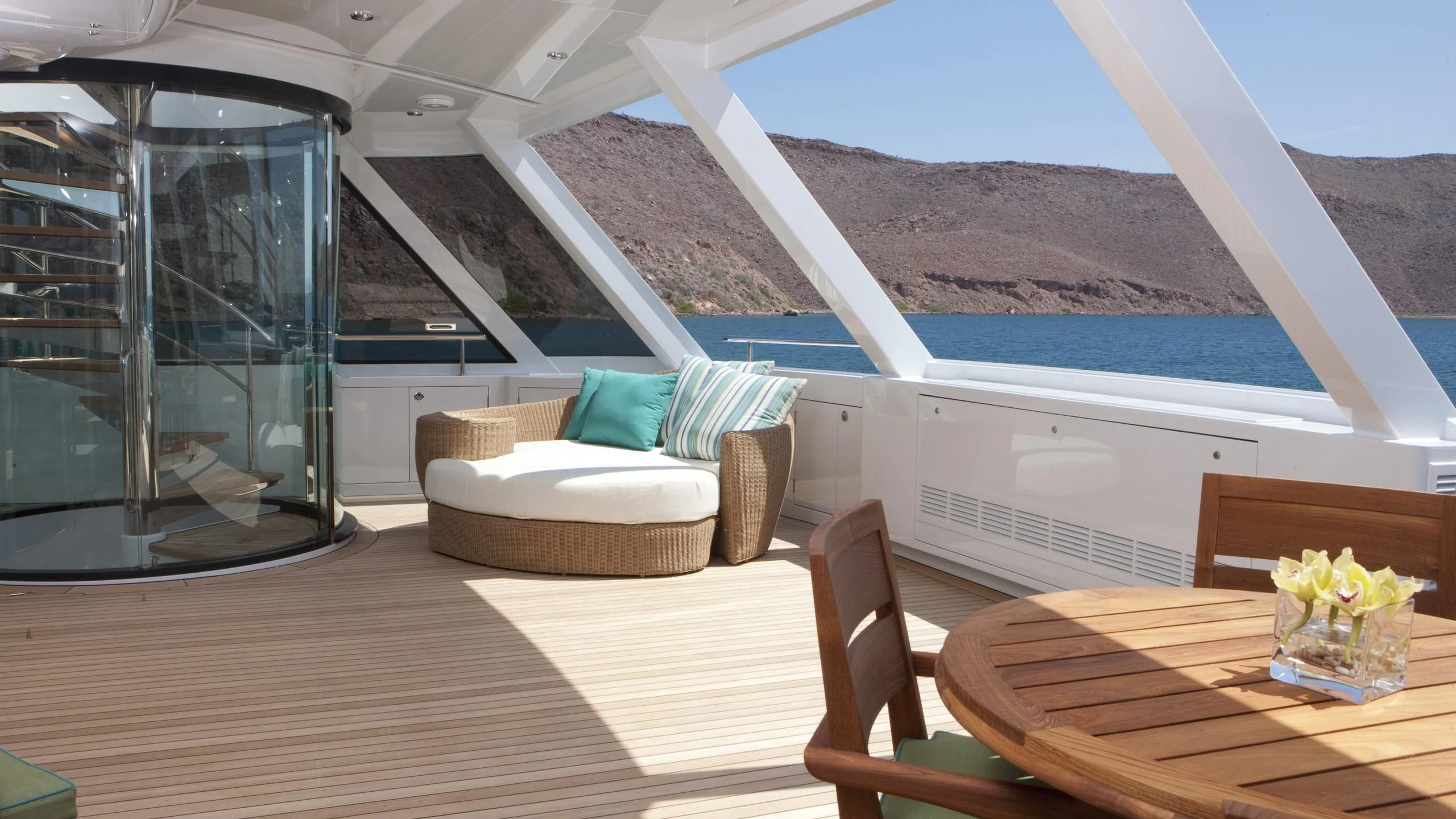 a room with a table and chairs aboard CHIRON Yacht for Sale
