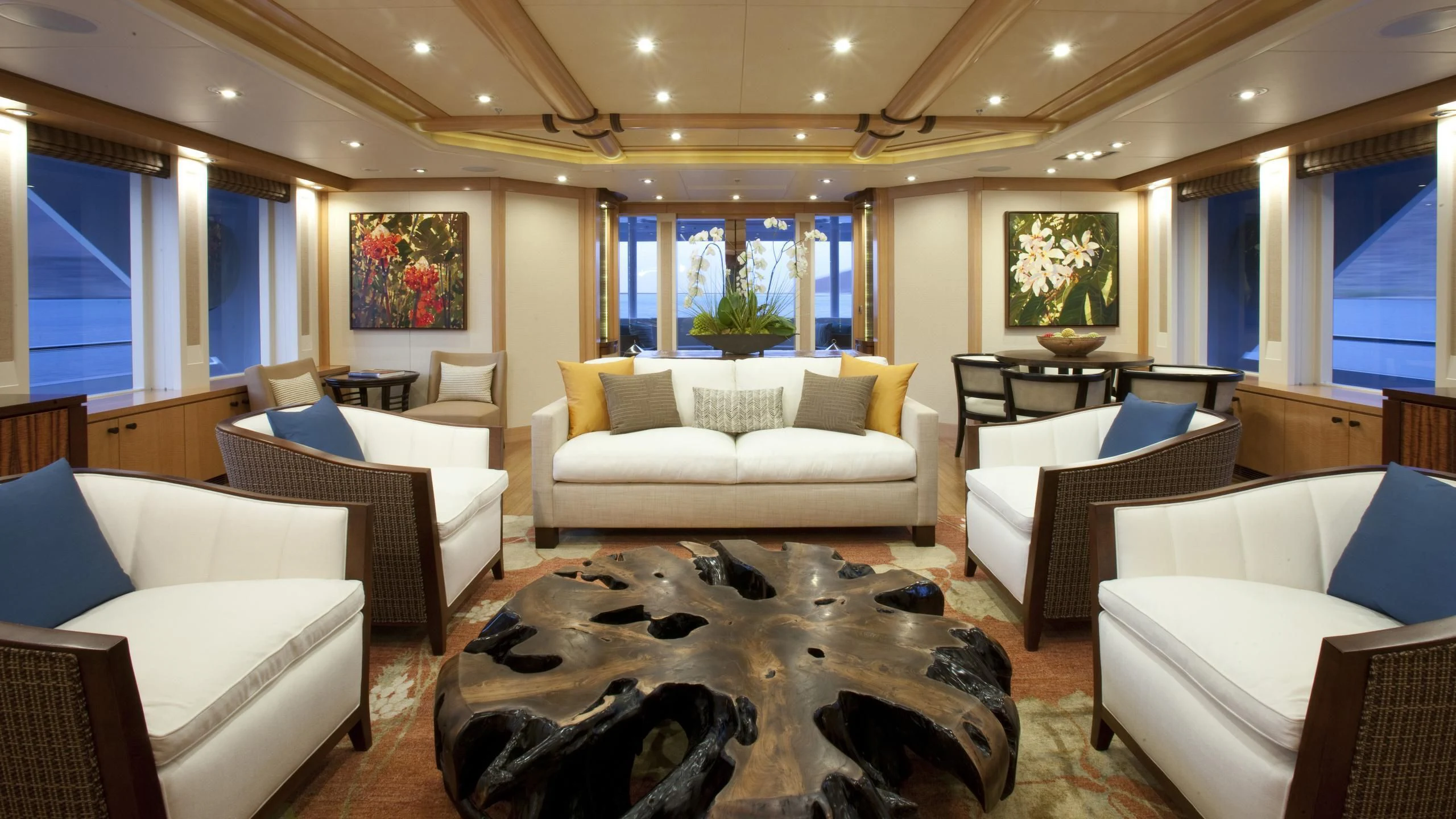 a living room with white couches aboard CHIRON Yacht for Sale