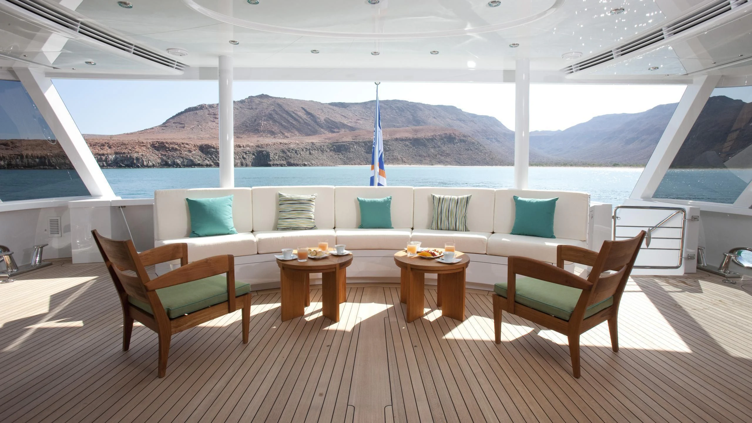 a room with a table and chairs aboard CHIRON Yacht for Sale
