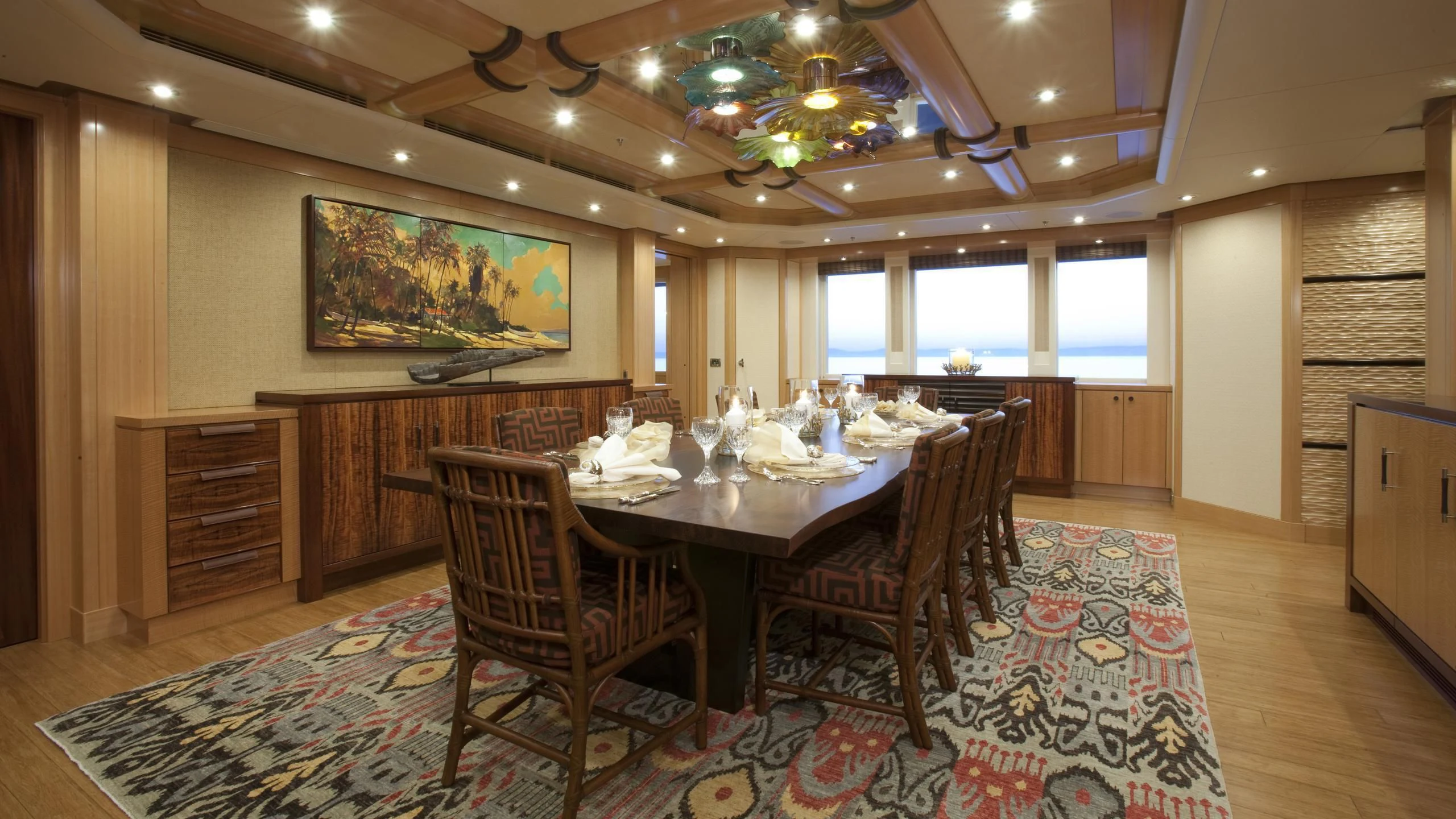 a dining room with a table and chairs aboard CHIRON Yacht for Sale