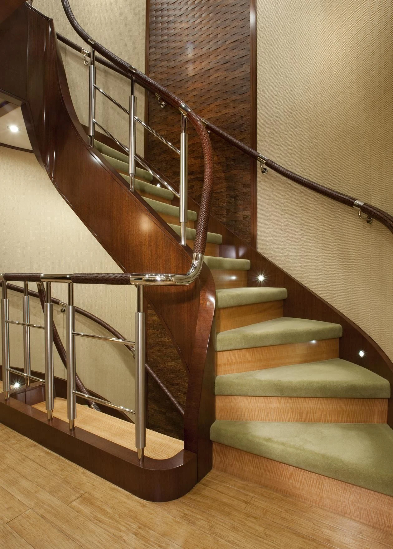 a staircase with a metal railing aboard CHIRON Yacht for Sale