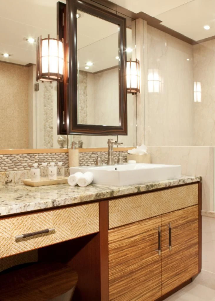 a bathroom with a large mirror aboard CHIRON Yacht for Sale