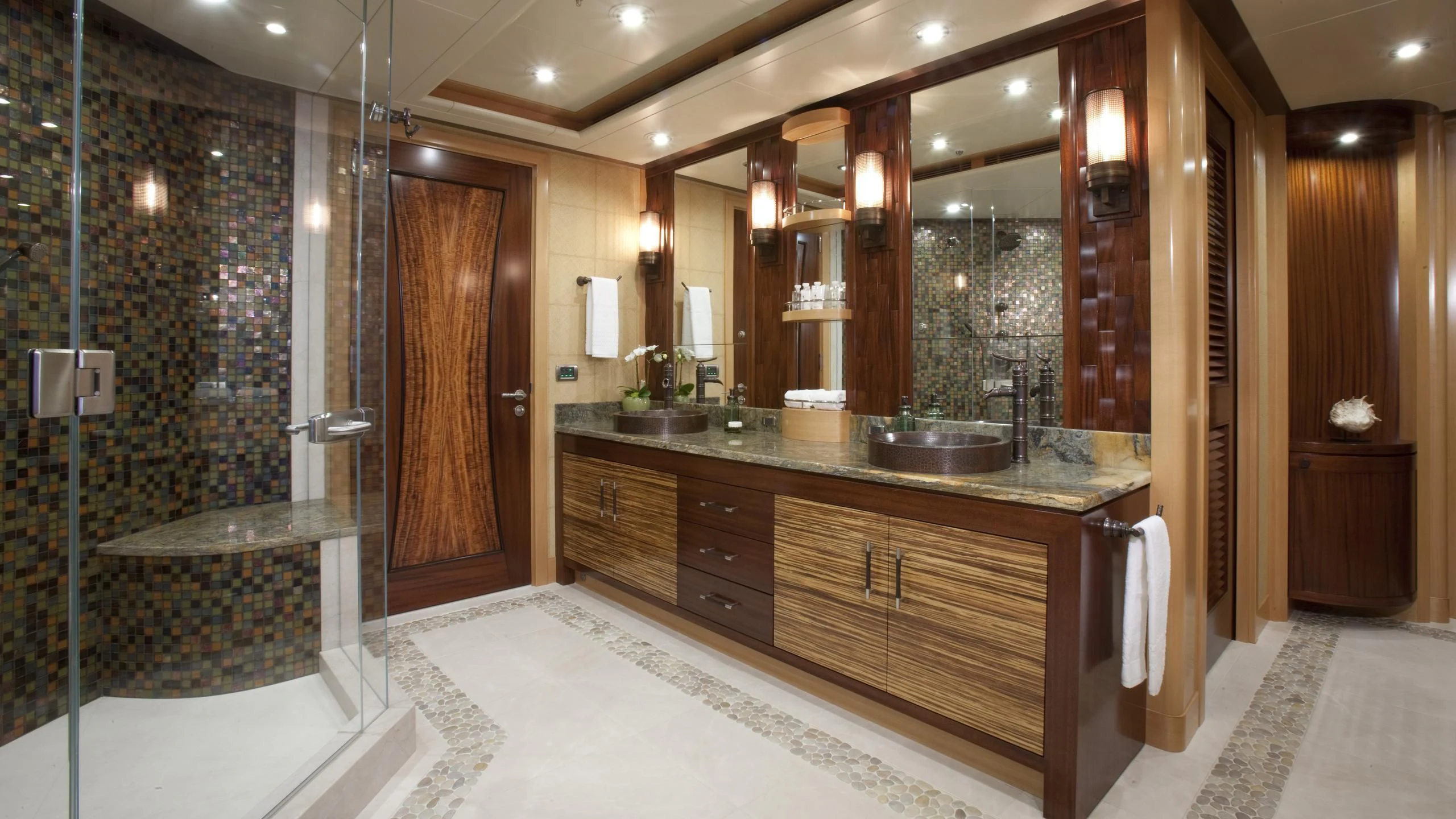 a bathroom with a large mirror aboard CHIRON Yacht for Sale