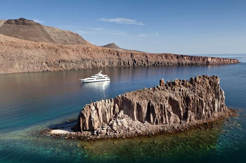 a boat sailing in the water aboard CHIRON Yacht for Sale