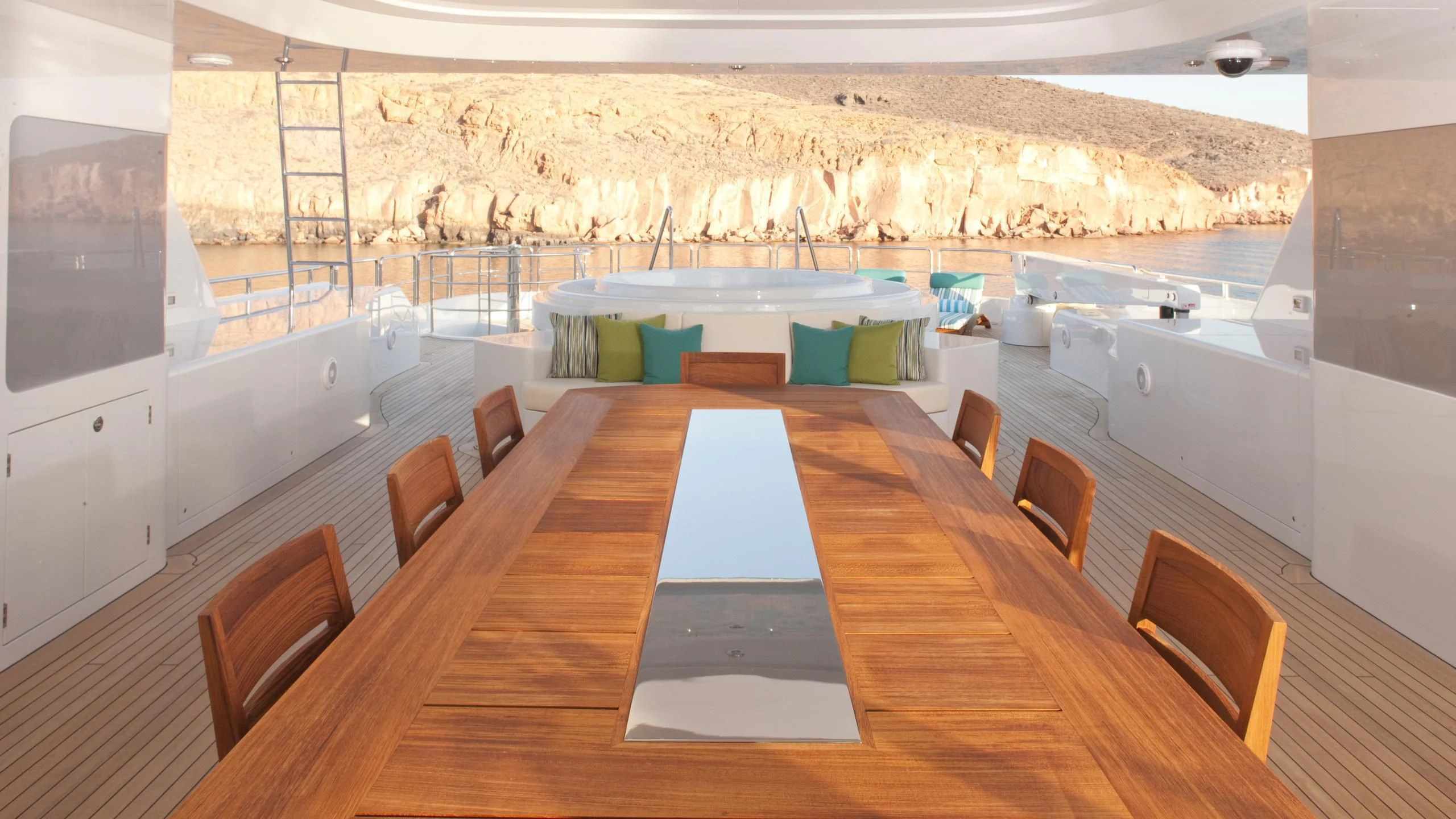 a table with chairs around it aboard CHIRON Yacht for Sale