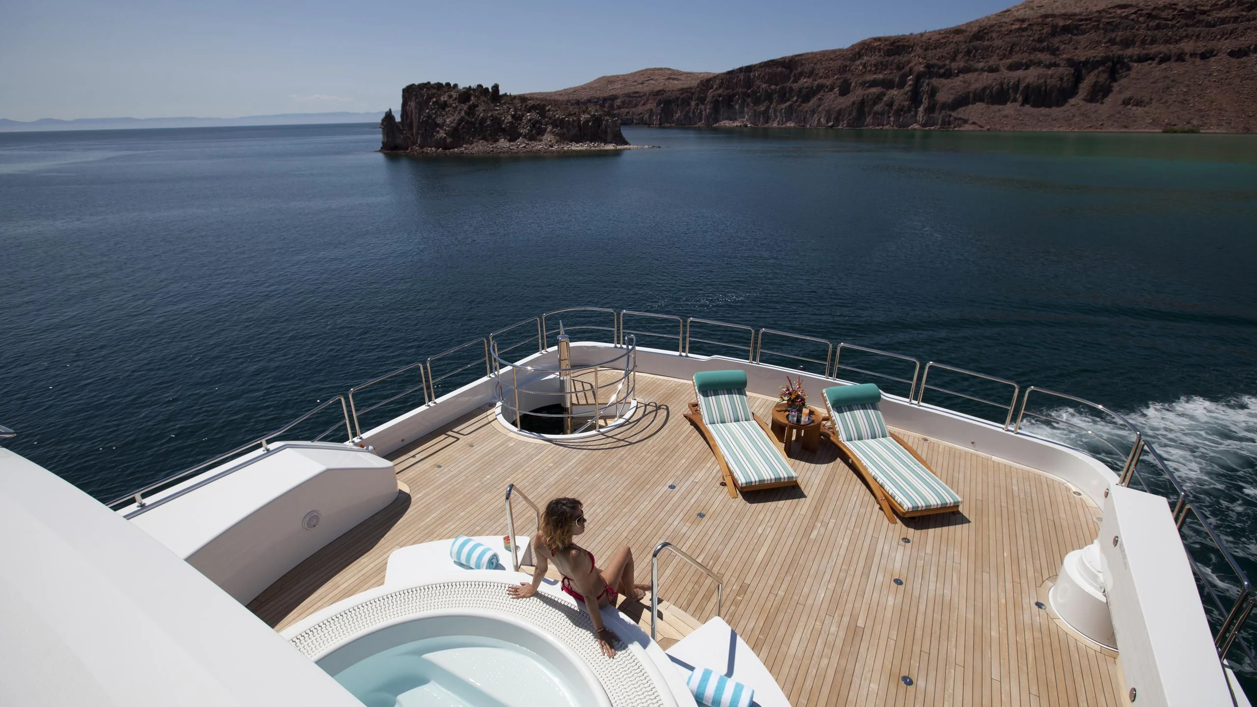 a person sitting on a boat aboard CHIRON Yacht for Sale