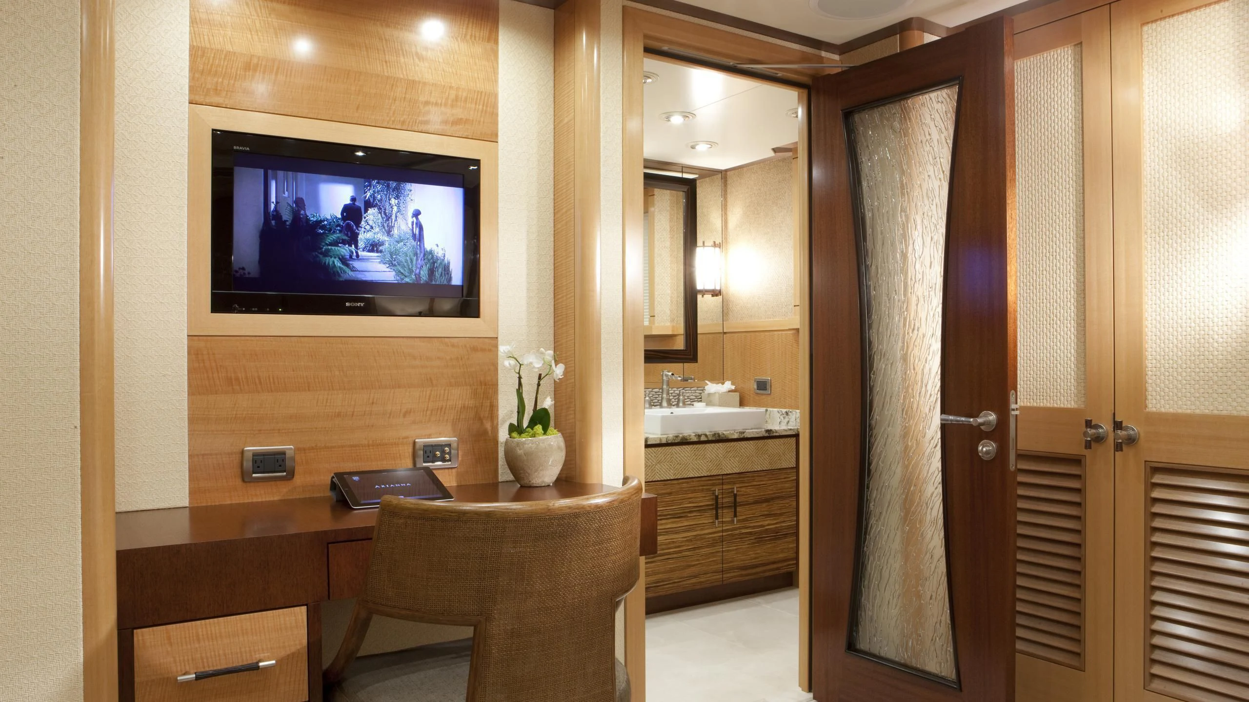 a tv on a wall in a bathroom aboard CHIRON Yacht for Sale
