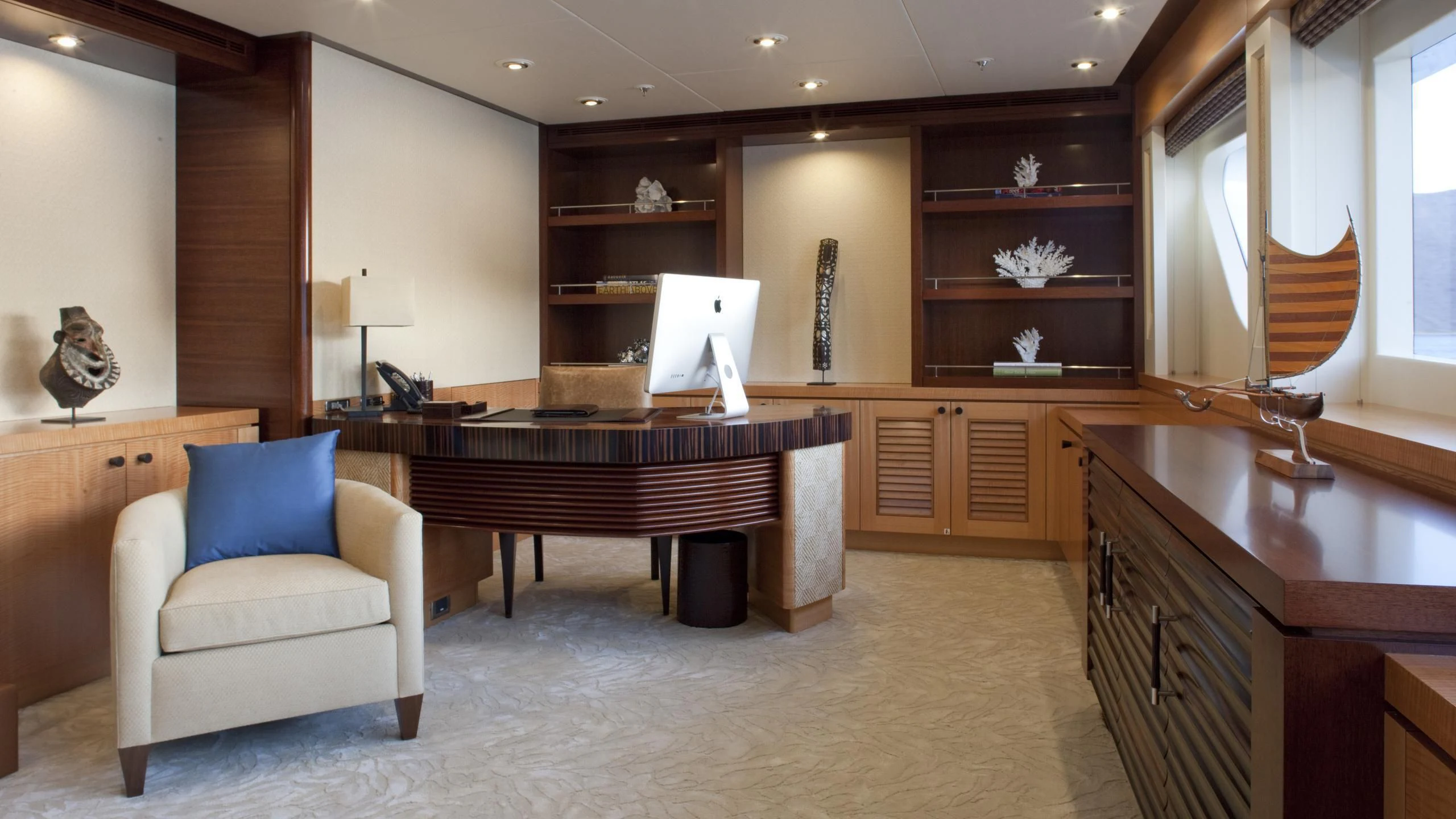 a room with a piano and a chair aboard CHIRON Yacht for Sale