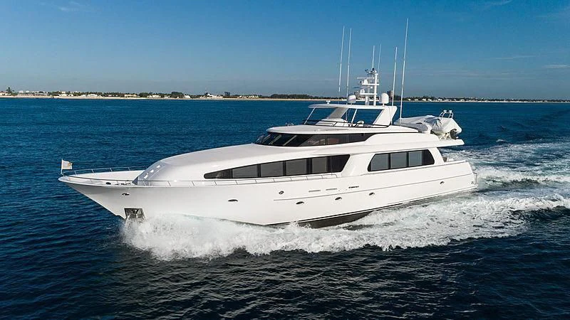 a white yacht on the water aboard THE BEELIEVER Yacht for Sale