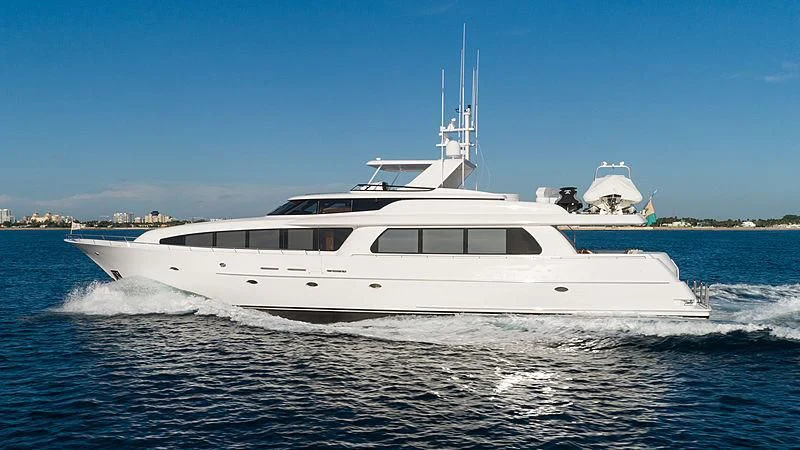 a white yacht on the water aboard THE BEELIEVER Yacht for Sale
