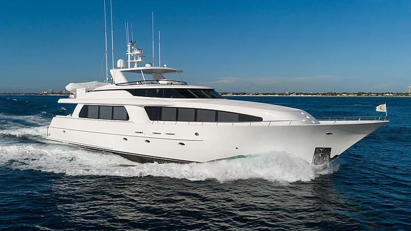 a white yacht on the water aboard THE BEELIEVER Yacht for Sale
