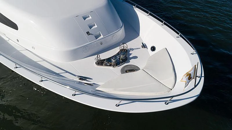 a white yacht on the water aboard THE BEELIEVER Yacht for Sale