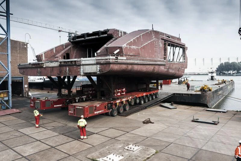 a large red boat on a trailer aboard LEVIATHAN Yacht for Sale