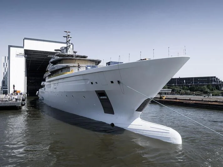a large white boat in a body of water aboard LEVIATHAN Yacht for Sale